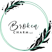 Broken Charm LLC circular logo with green ring and leaf design