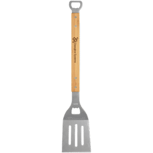 Stainless steel barbecue spatula with bamboo handle and engraved logo, featuring a built in bottle opener on a transparent background