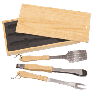 Three piece barbecue tool set with bamboo handles in an open wooden pine box with foam insert