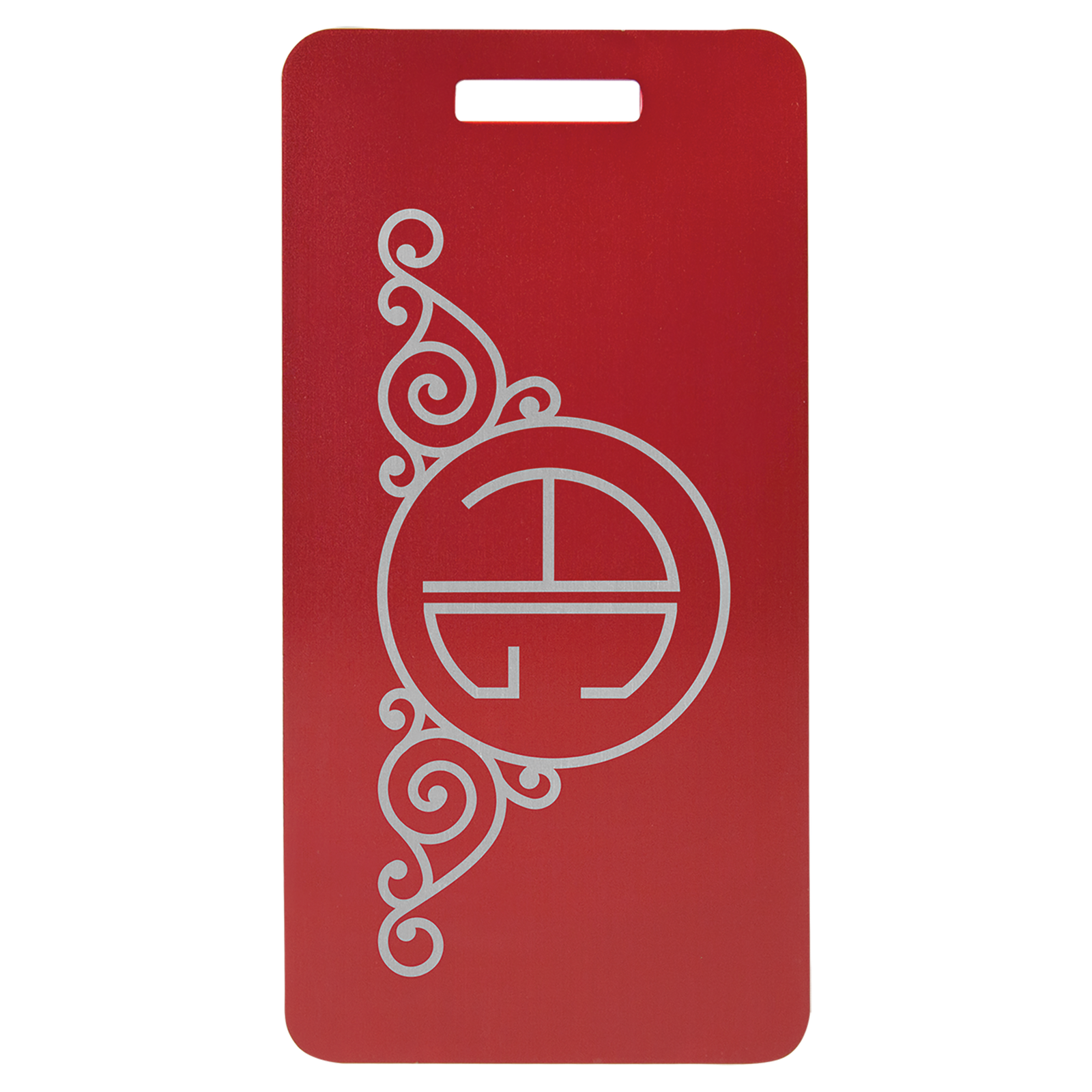 Red anodized aluminum luggage tag with decorative swirl design and circular monogram.