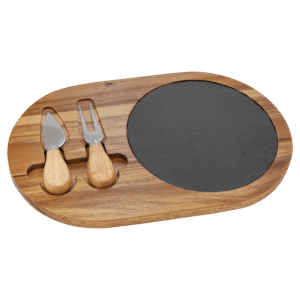 Acacia wood and slate oval cheese serving board with two stainless steel cheese tools and wooden handles on a transparent background.