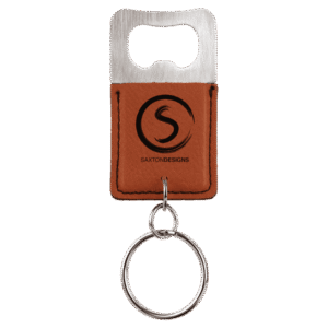 Leatherette bottle opener keychain with brushed metal opener top and brown stitched leatherette body featuring the Saxton Designs logo.