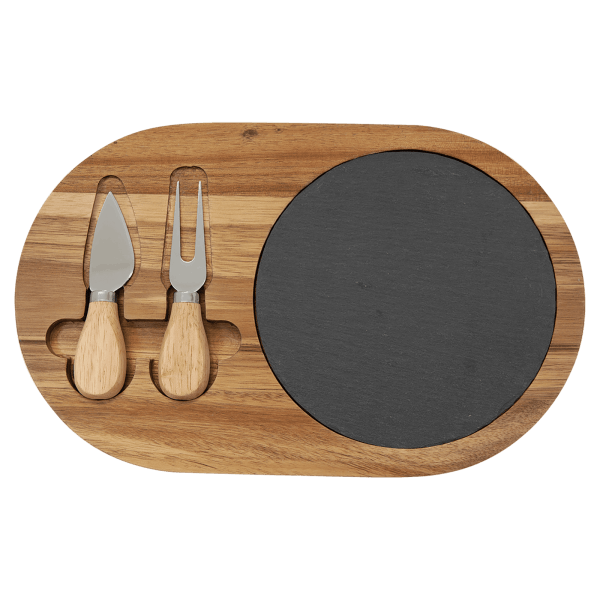 Personalized acacia wood and slate oval cheese board set with two stainless steel cheese tools and wooden handles on a transparent background.