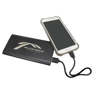 black Custom engraved wireless charger power bank charging a smartphone with USB cable