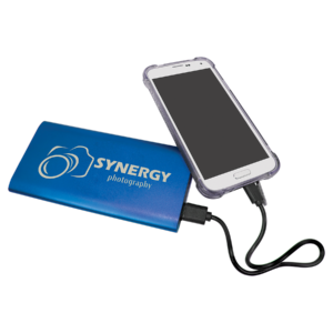 Blue aluminum wireless charger power bank connected to a smartphone, featuring custom white laser engraved logo and 8000mAh rechargeable battery.