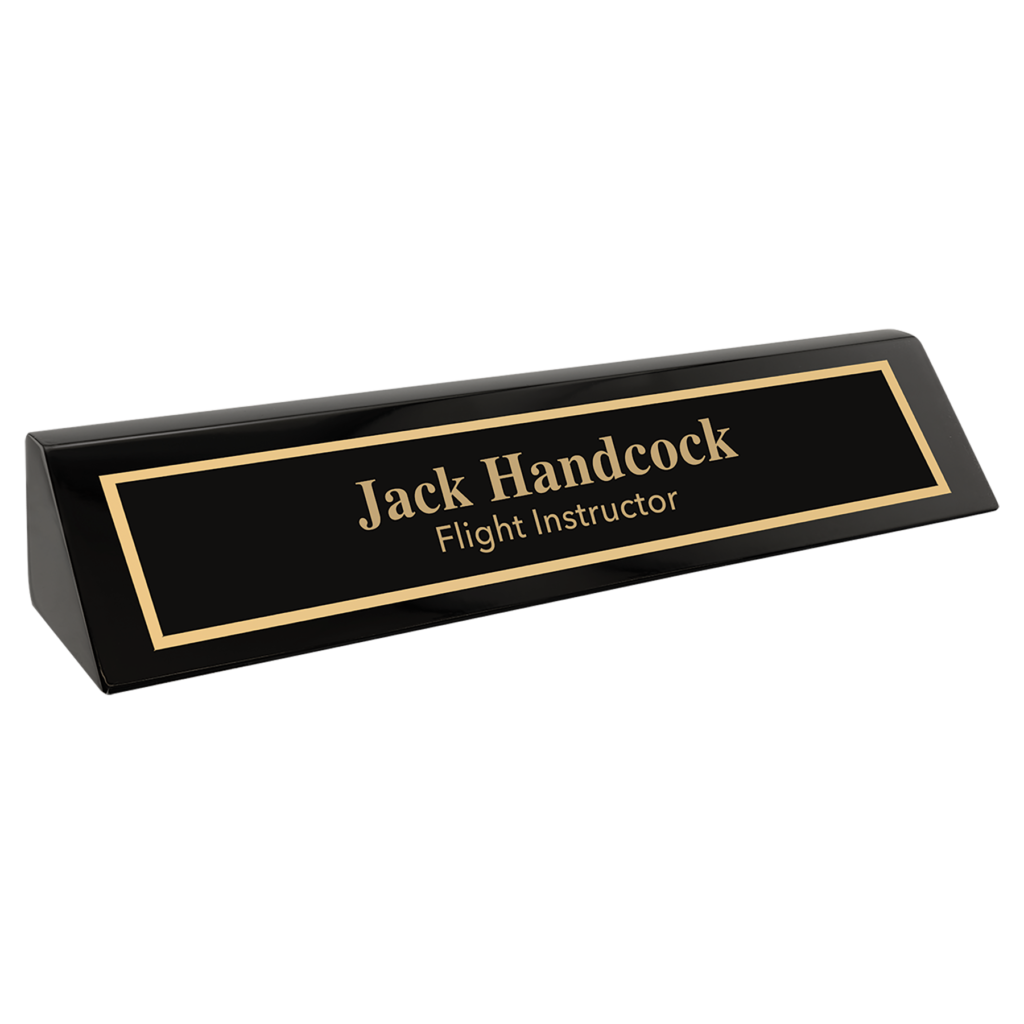 Personalized black desk wedge with a glossy piano finish and custom gold nameplate