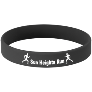 Black personalized silicone bracelet with white laser engraving for an event, team, fundraiser, or custom message