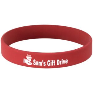 Red and white laser engraved bracelet featuring Sam’s Gift Drive with a gift icon