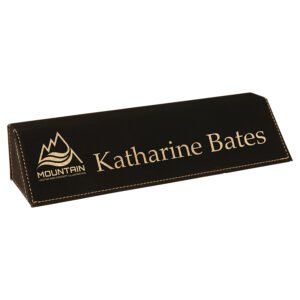 Custom black leatherette desk wedge with gold laser engraved logo and name